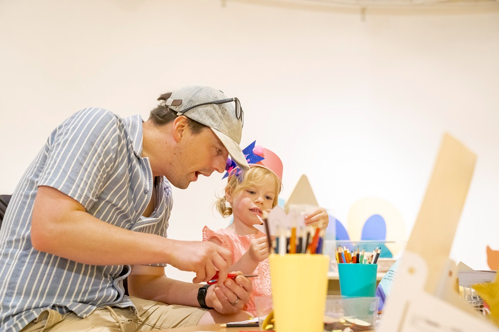 A man and a girl enjoying creative arts